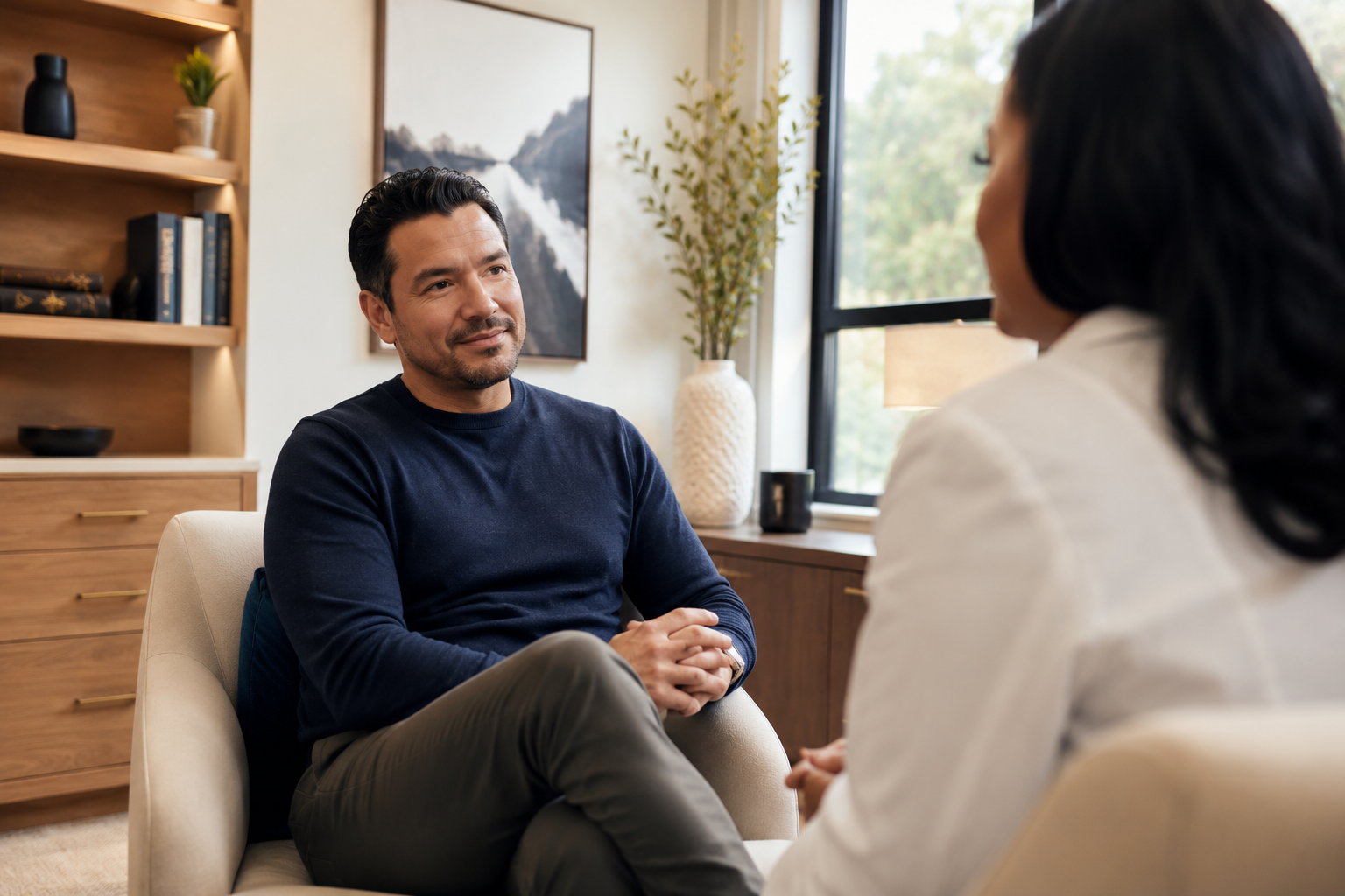 Dr. Griffith speaking with a patient during a private consultation
